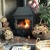 How is a wood burning stove with back boiler connected?